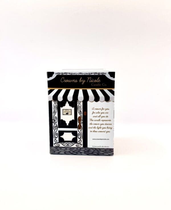 A box from "Sass in Scarlett Candle Co." with black and white striped design and text about candle features.