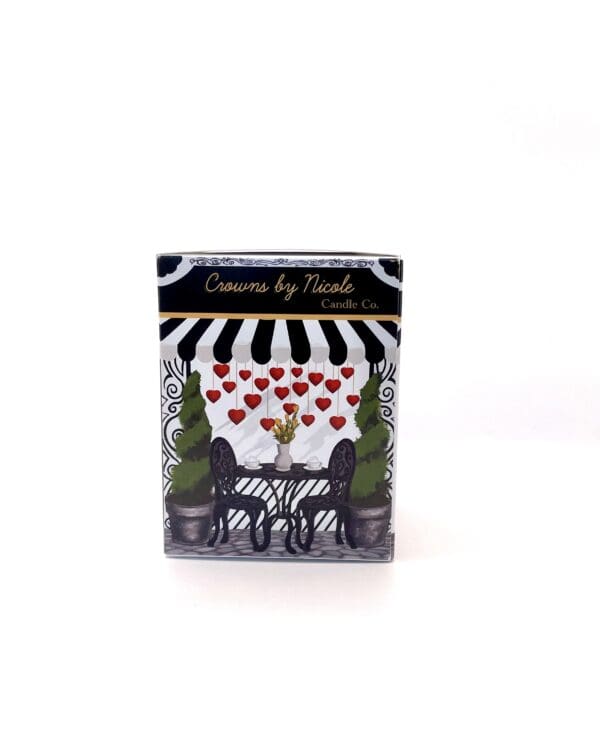 A decorative candle box from Ethereal for My Heart candle co., featuring an illustration of a crown, hearts, and a whimsical chair on a black and white striped background.